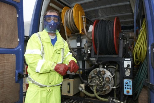 Ready for Work A member of the Bourton Drain Services team getting ready for work